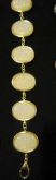 Pulseira dourada com pedras Brancas